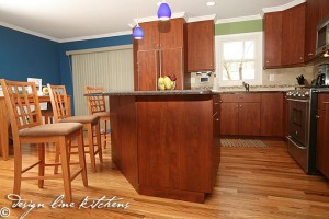 Custom-Kitchen-photo-cooking-center-aspen-cabinets-maple-island