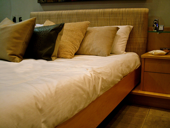 Piling plenty of pillows on your bed can make your bedroom more dreamy.